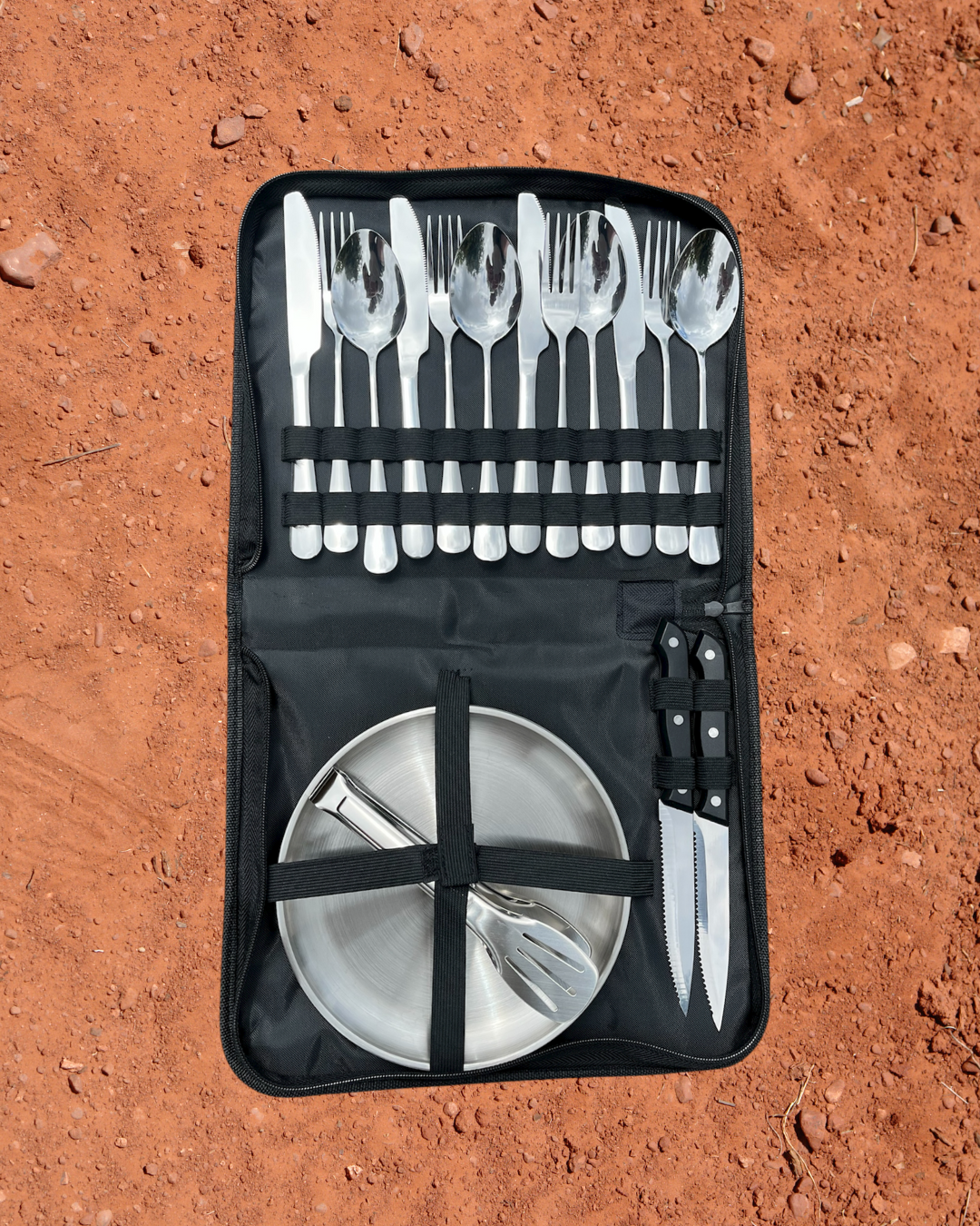 Camping Utensil Set. With red dirt background.