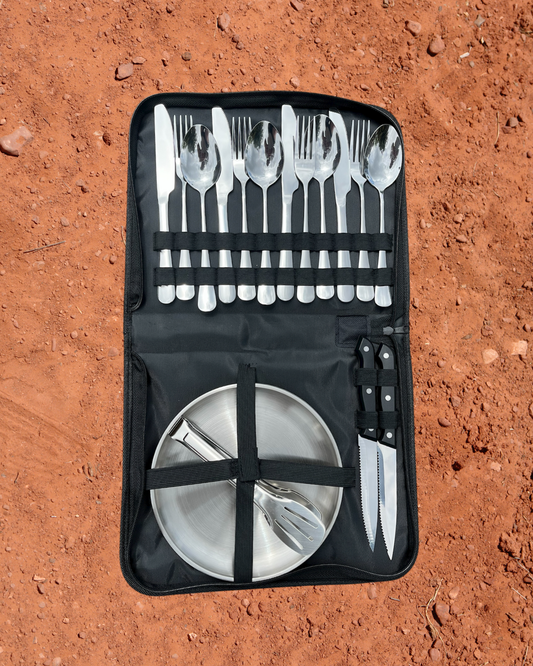 Camping Utensil Set. With red dirt background.
