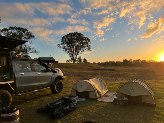 Ute parked next to an inflatable swag and a normal swag both by Cranky Croc Camping 