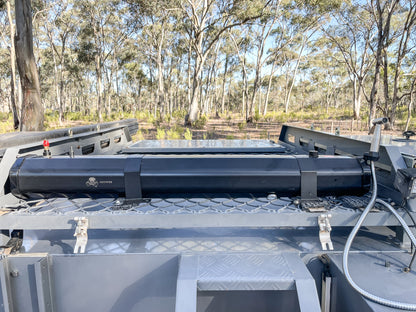 Roof mounted Shower System on a 4WD ute canopy in bush land. The solar shower is heating up in the sun.
