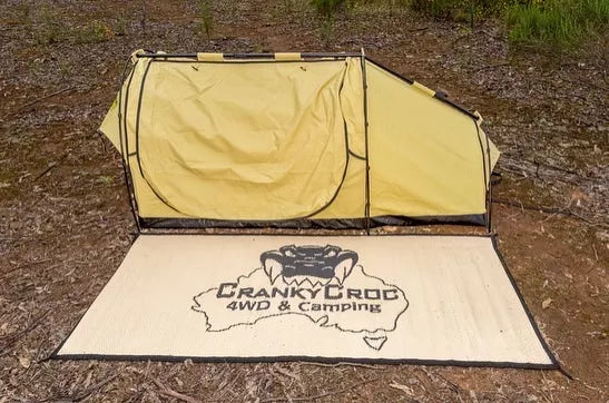 Dundee King Single Swag with Swag Mat set up in bushland.