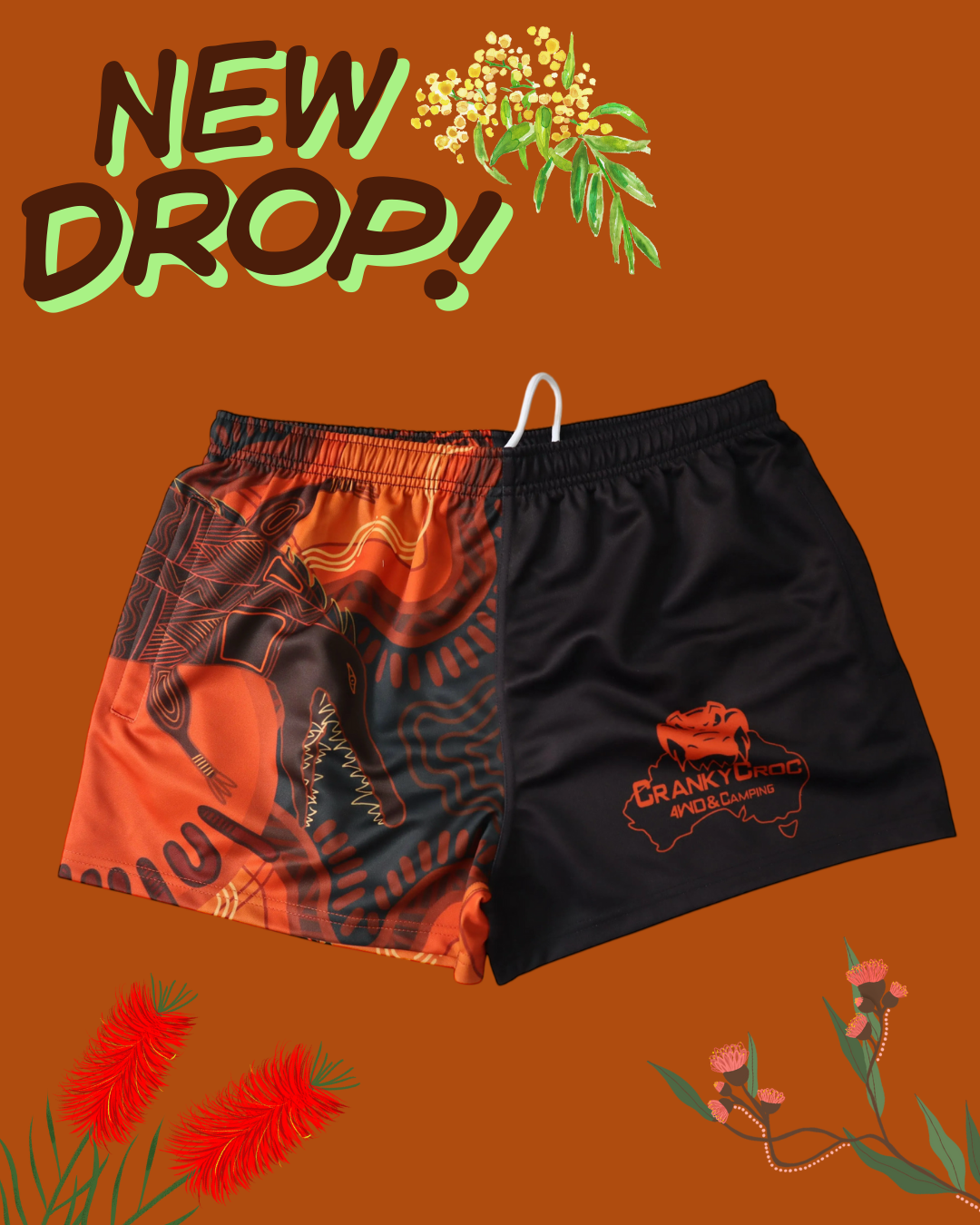 Pair of indigenous art footy shorts on an orange background with floral elements and 'NEW DROP!' text.