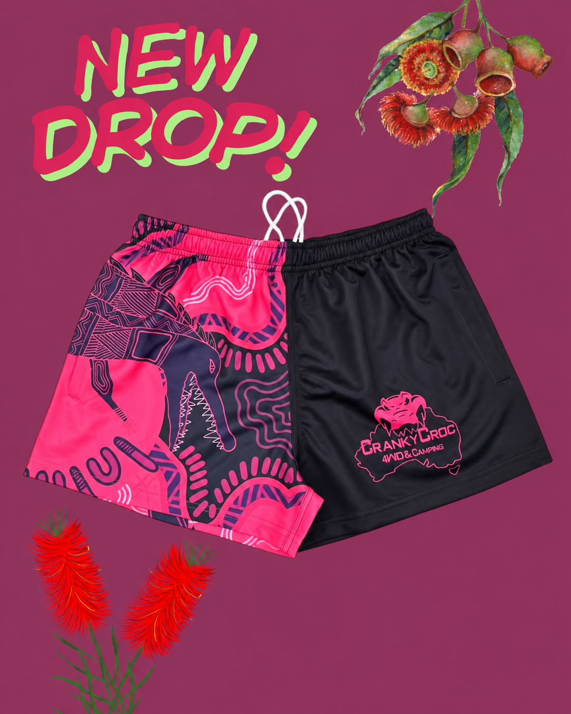 Pair of indigenous Footy Shorts on a purple background with floral elements and 'New Drop!' text.