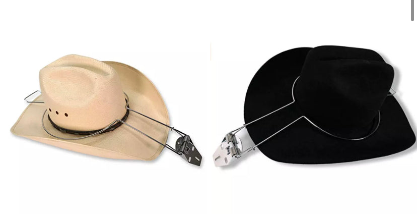 Two hats attached to steel cowboy hat holders, one beige hat and one black hat, displayed against a white background.