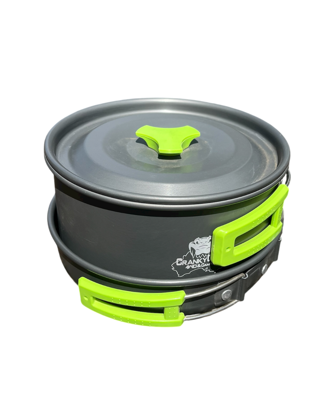 Compact camping pot and pan set stacked on top of each other with a white background