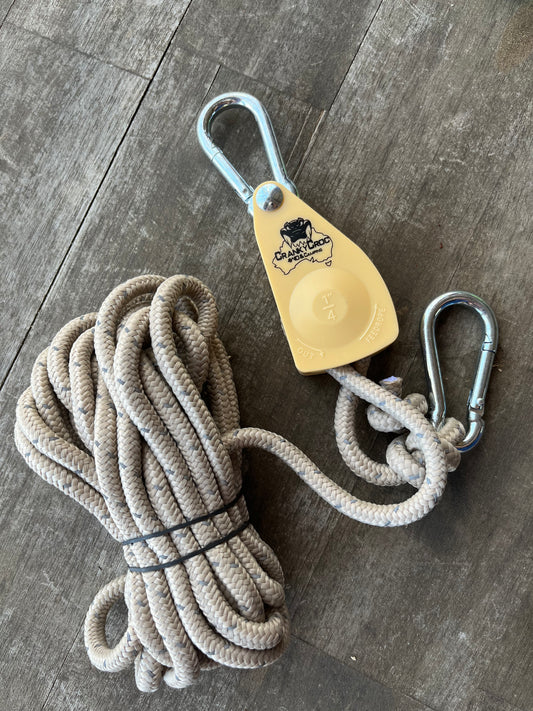 Cranky Croc branded tie down straps. The ratchet strap is on a timber background