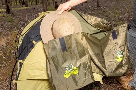 Hand pulling out an Akubra out of a Large Double Boot Bag