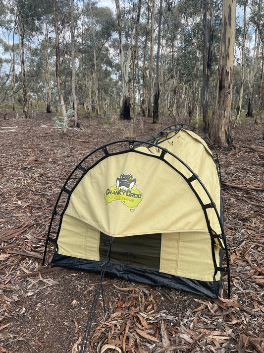 Dome Deluxe Single Swag set up long ways in bush land 