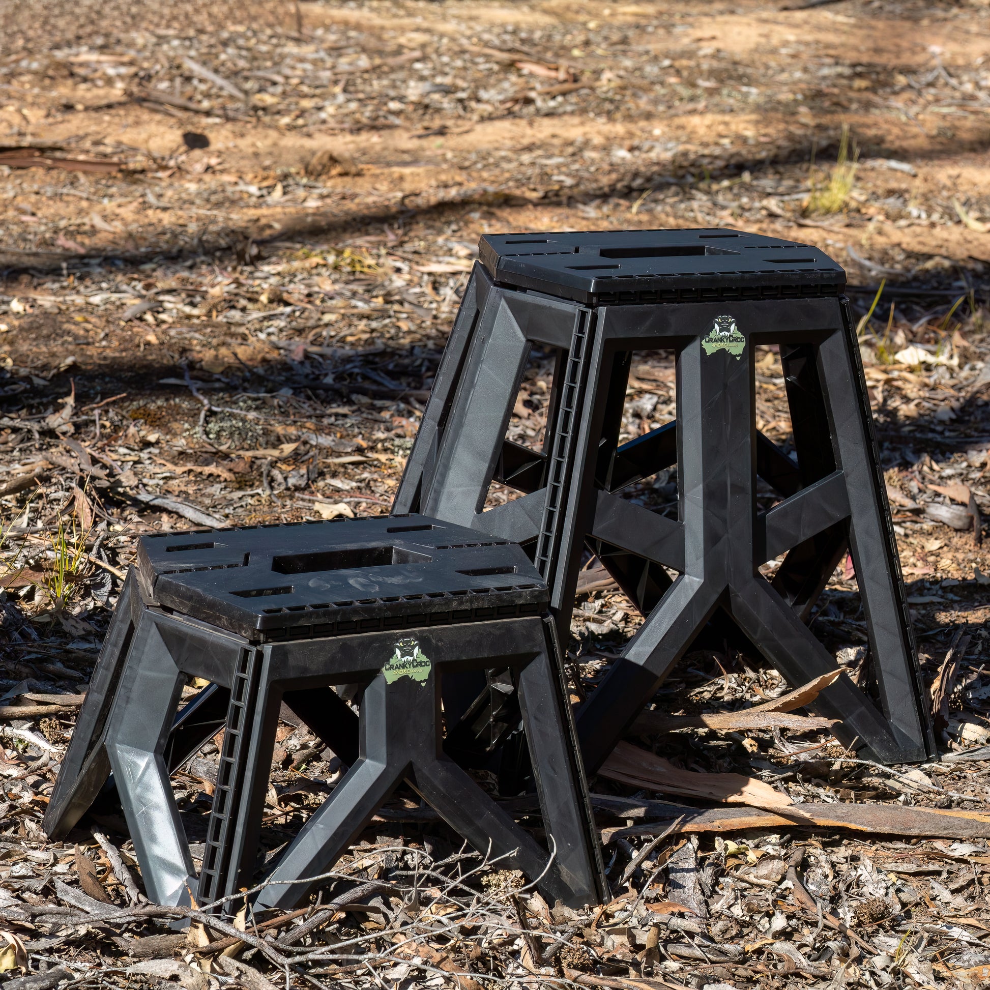 Image of both a small sized and large sized Quickie Folding Step Stool in bushland coloured Black