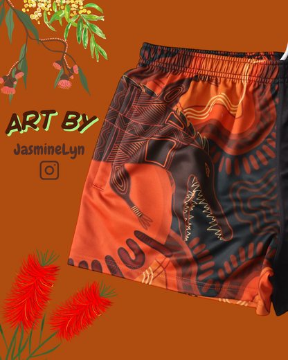 Orange indigenous Aussie Footy Shorts with an orange background, featuring 'Art by JasmineLyn' text.