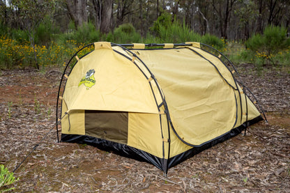 Deluxe swag set up in bushland. The king single swag is fully zipped up.