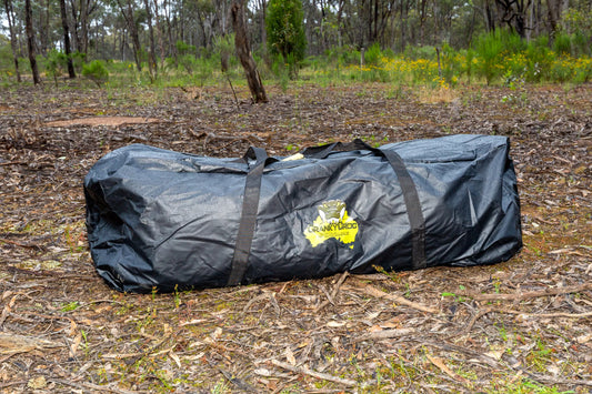 Black PVC swag bag to suit king single swag sitting in bushland