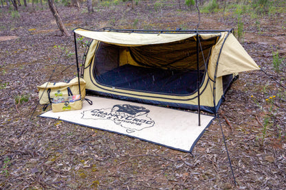 Swag setup in bushland with Clear Top Bag sitting in front 