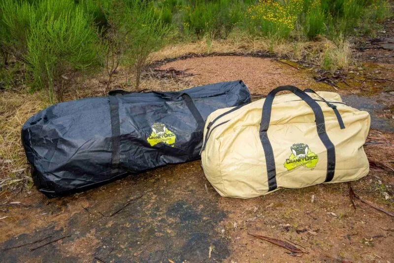 Canvas Swag Bag and PVC swag bag sitting in bushland