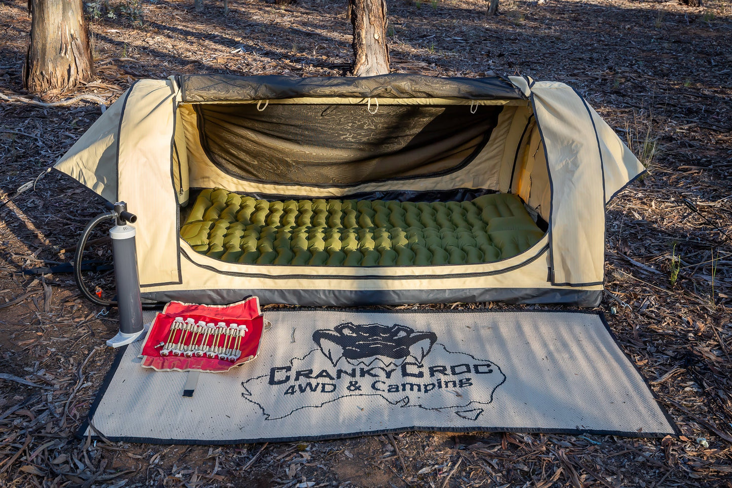 Inflatable swag in bushland with Swag Mat and Screw in tent pegs set