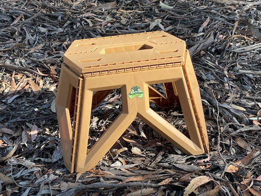 Small sized caravan steps. Coloured brown with bush land background.