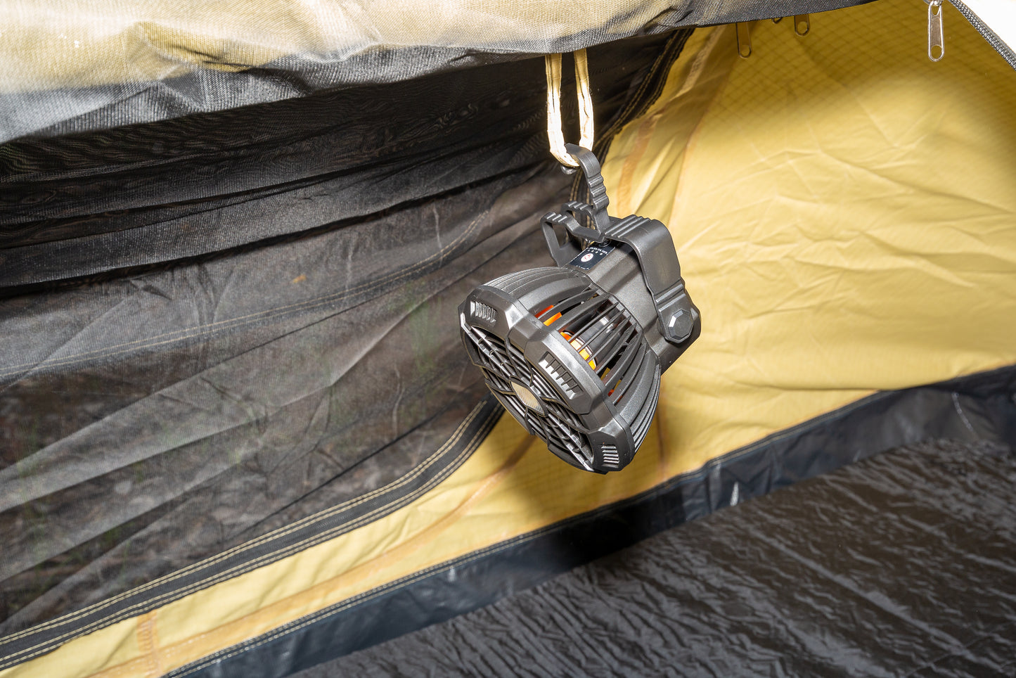 3 in 1 Rechargeable Tent Fan, Light & Phone Charger hanging by built in hook from inside of swag or tent