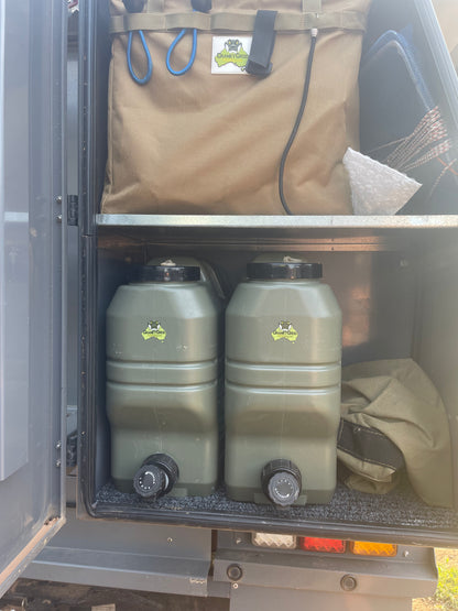 Two water drums or water jerry cans used for camping in ute canopy