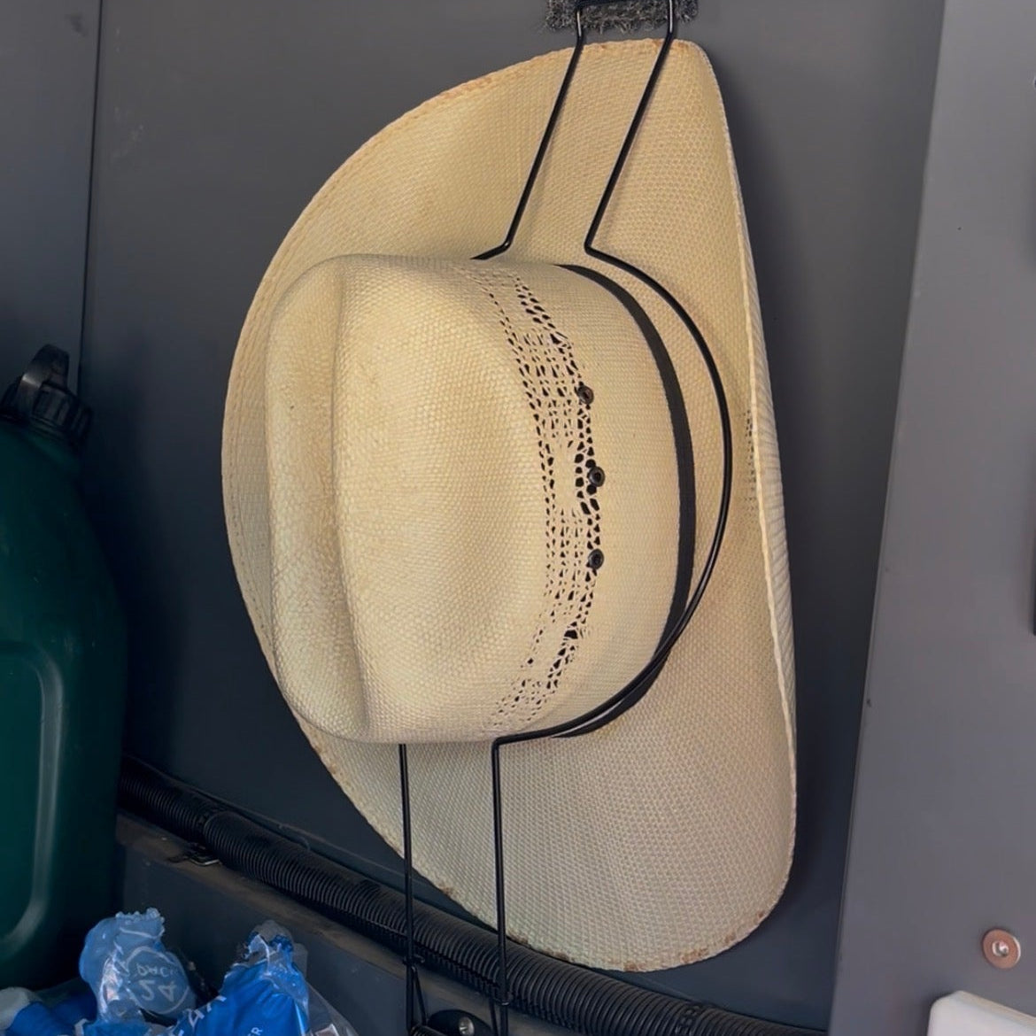 Akubra or Wrangler hat being held to 4WD canopy wall with a Cranky Croc Car Hat Holder