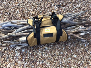 3-in-1 Wood Carry Bag on ground storing bundle of sticks for camp fire