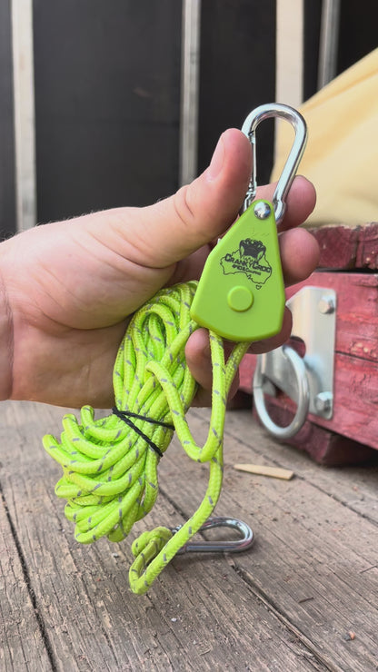 Video of a man tightening a green Cranky Croc branded ratchet tie down straps. The man is demonstrating how to tighten and losen the green tie down straps