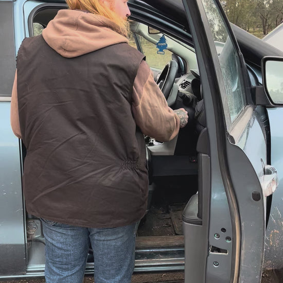 Man using Cranky Crocs Portable Lithium Jump Starter on flat battery. Jump starts car easily