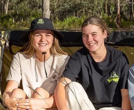 Two young woman girls wearing Cranky Croc T shirts and Hats 